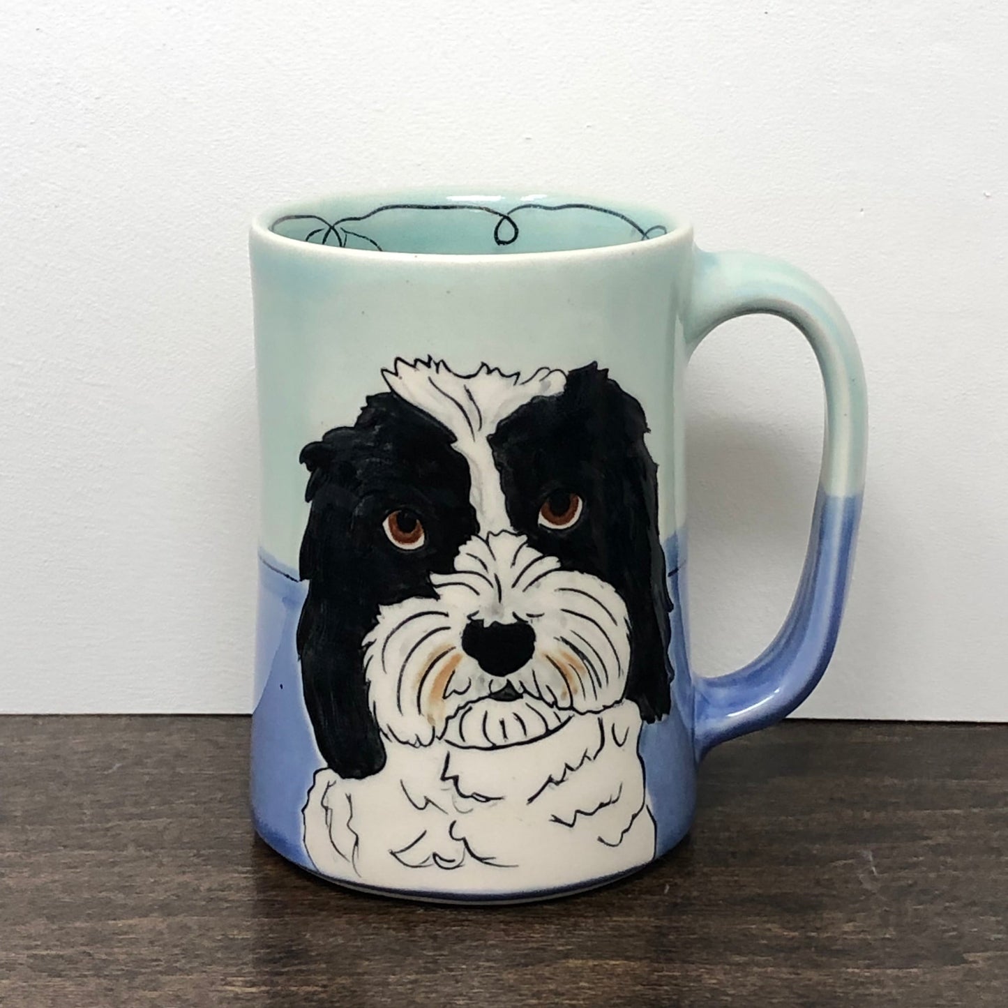 Custom mug with a dog in Aqua and Blue glaze