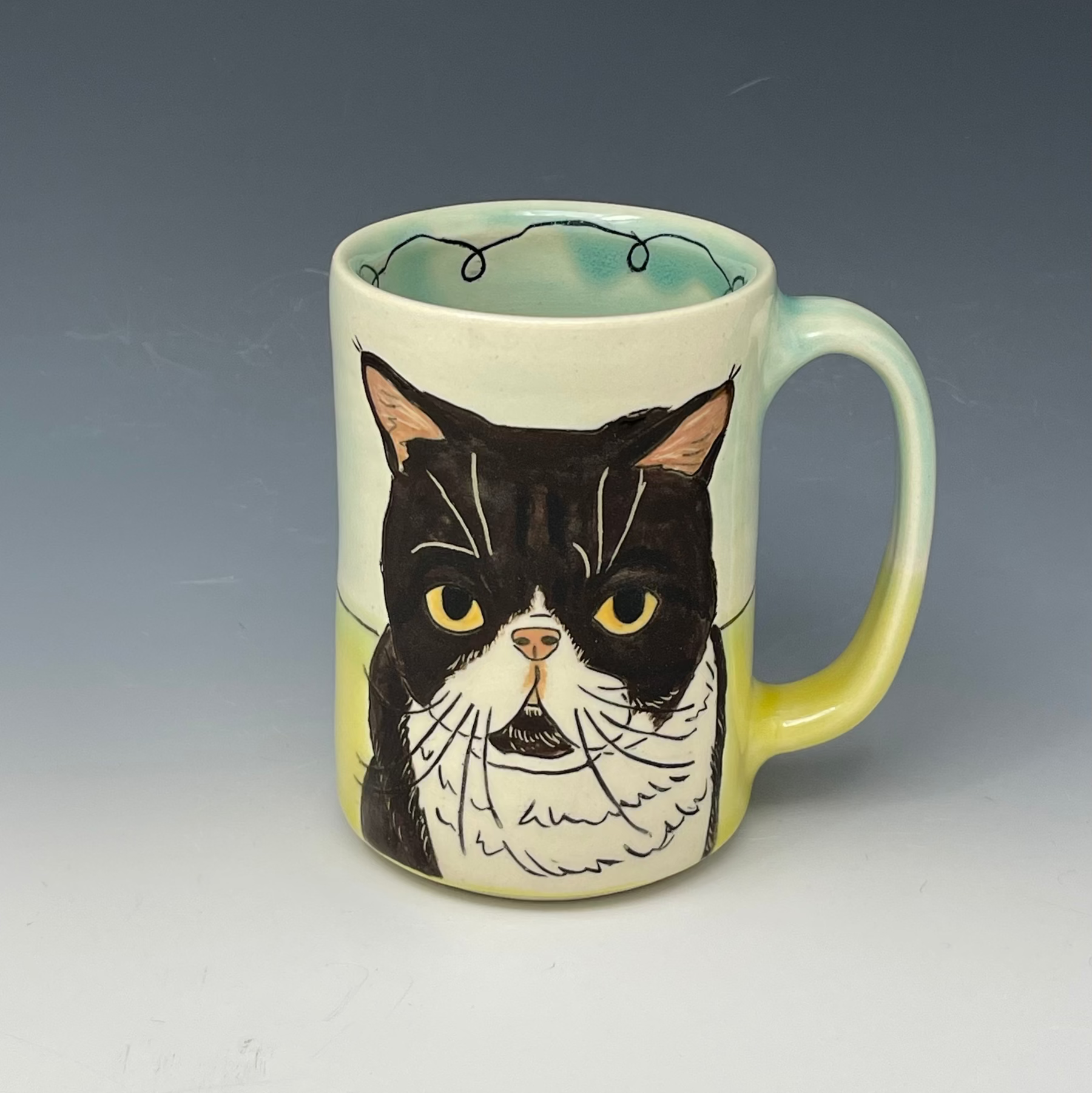 handmade mug with custom drawing of a kitty