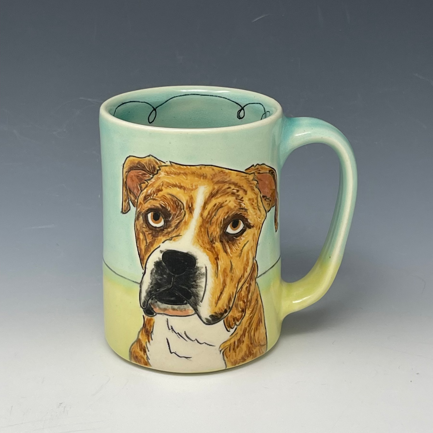 Ceramic mug with a dog's face on a plain background